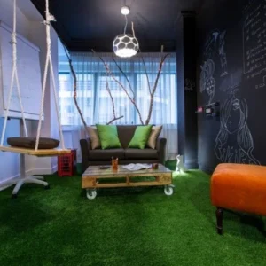 Artificial grass flooring in creative office lounge