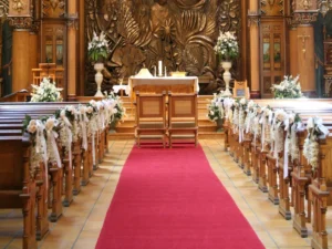 Red carpet runner along church aisle