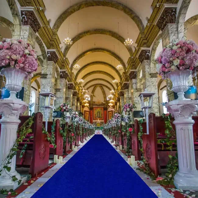 Blue exhibition carpet runner down church aisle