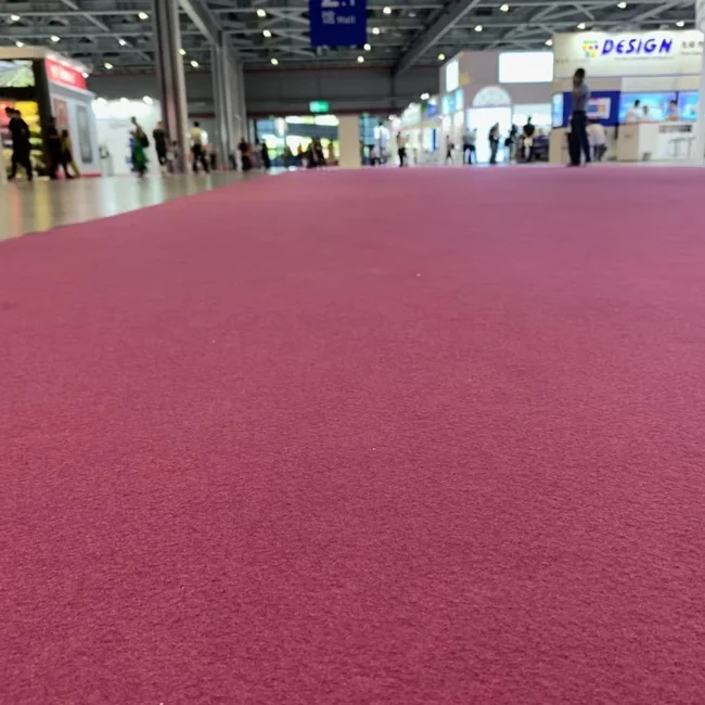 Magenta exhibition carpet flooring in event hall