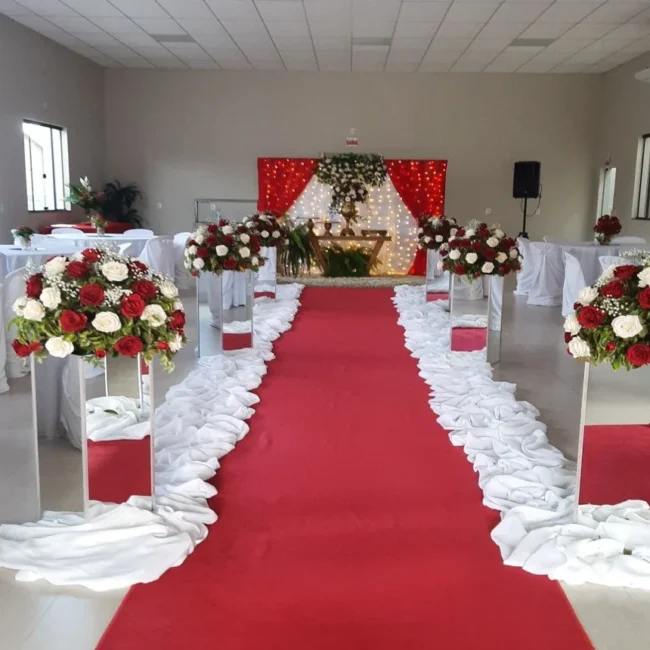 Red exhibition carpet runner in decorated hall