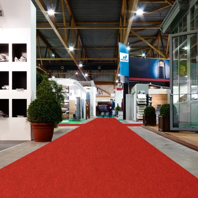 Red exhibition carpet runner in display hall