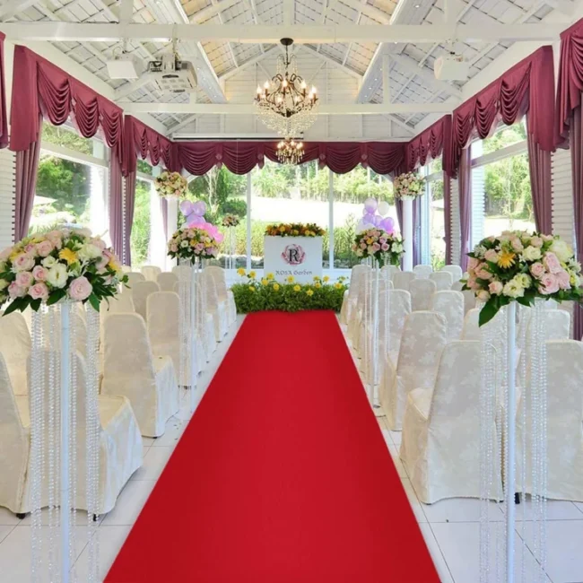 Red exhibition carpet runner in wedding hall