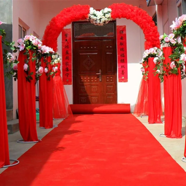 Red exhibition carpet runner leading to entryway